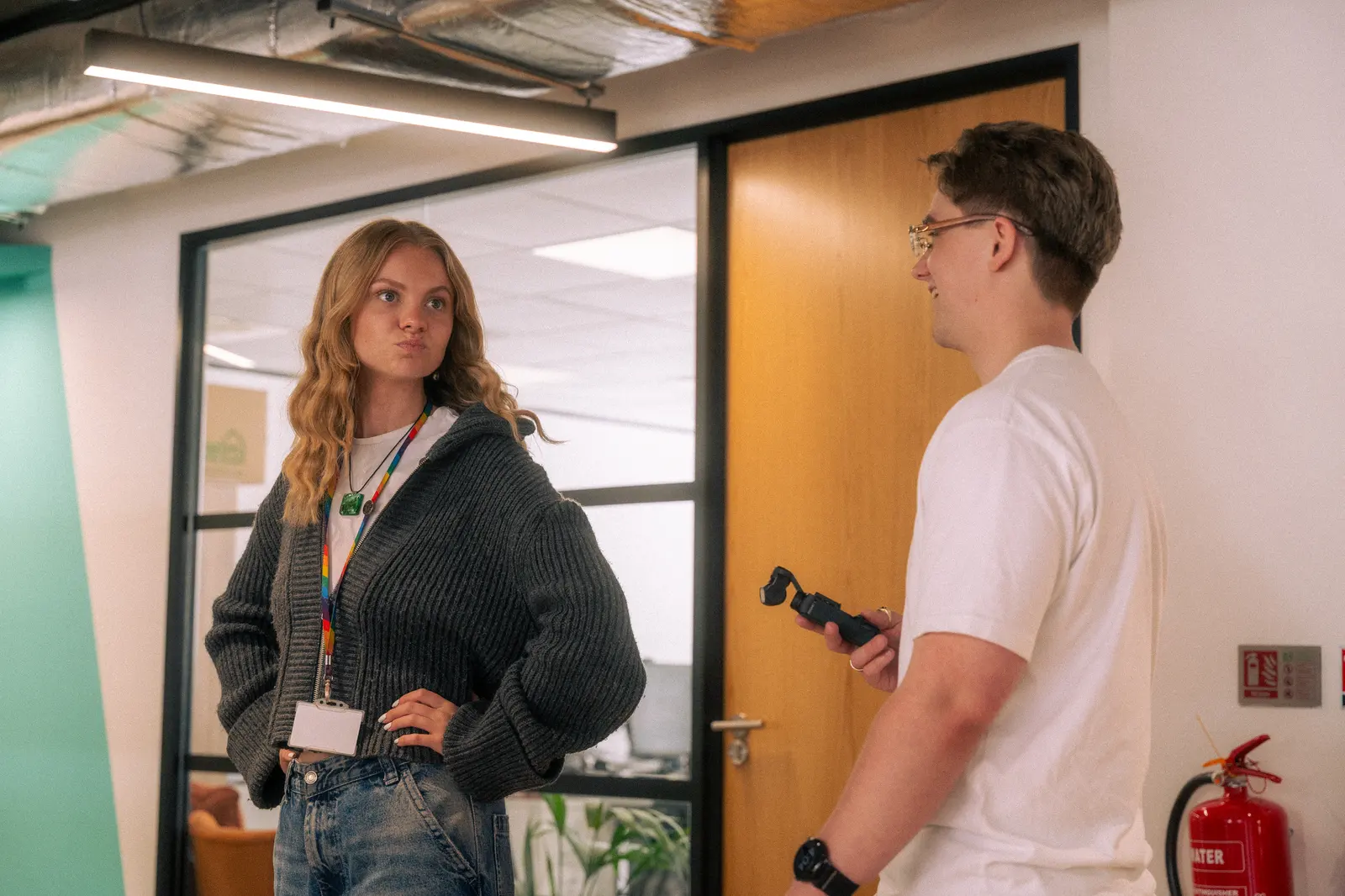 Exposure Marketing team discussing production work in the office.