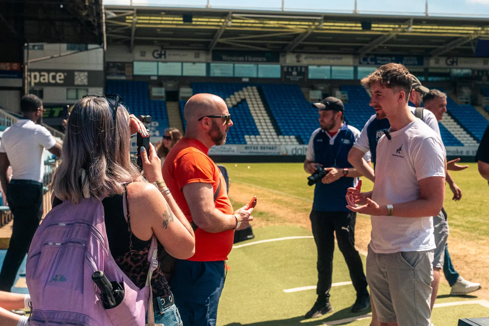 Exposure Marketing filming a Football Vs. Cancer pitch-side interview.