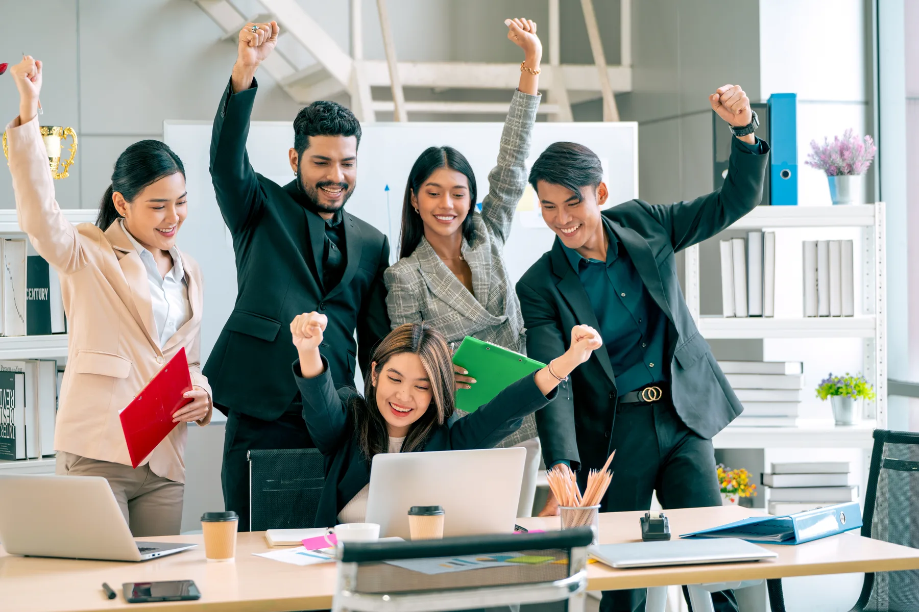 Business team celebrating a successful outcome.